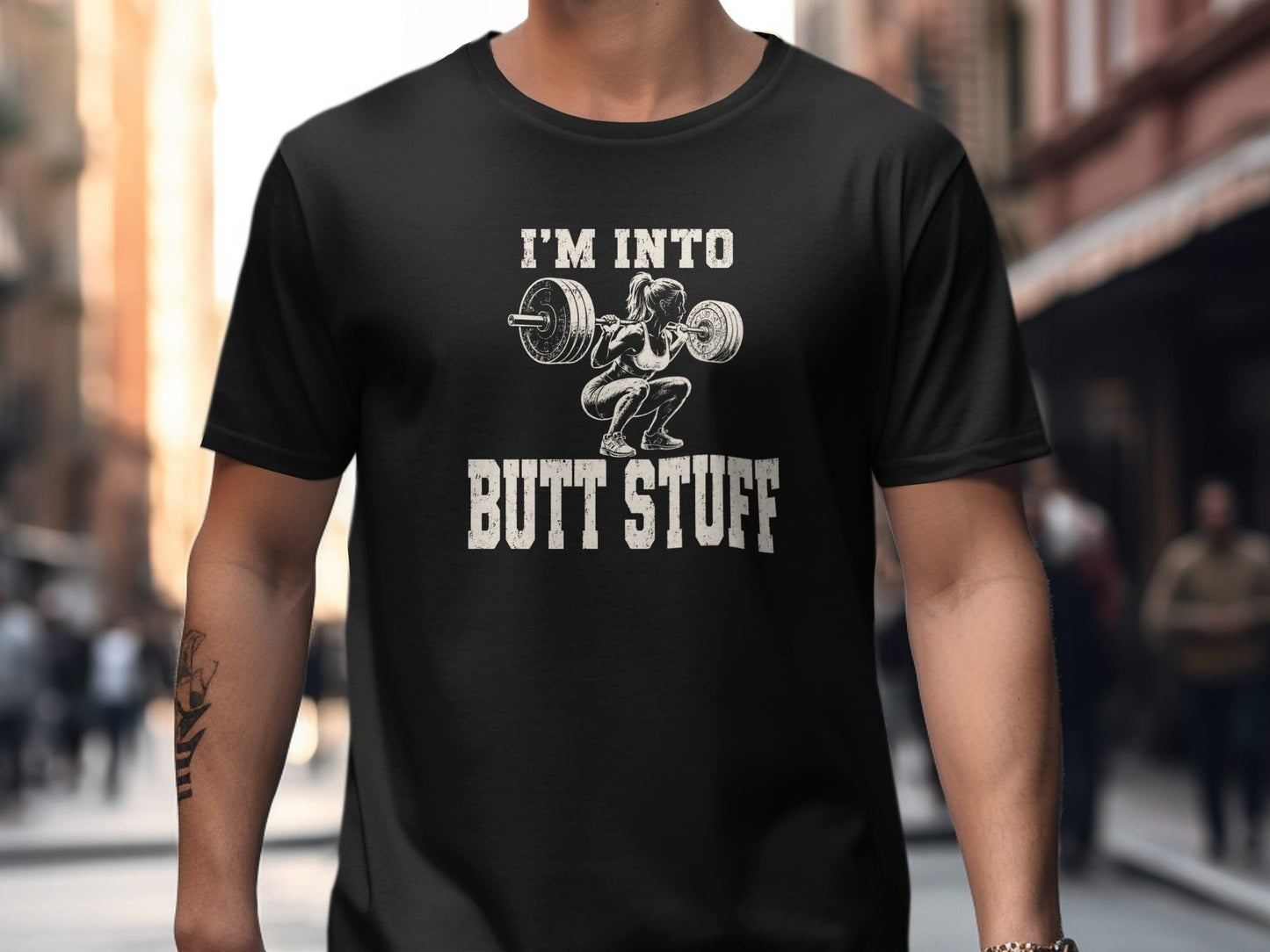 Black t-shirt with "I'M INTO BUTT STUFF" and weightlifter graphic.