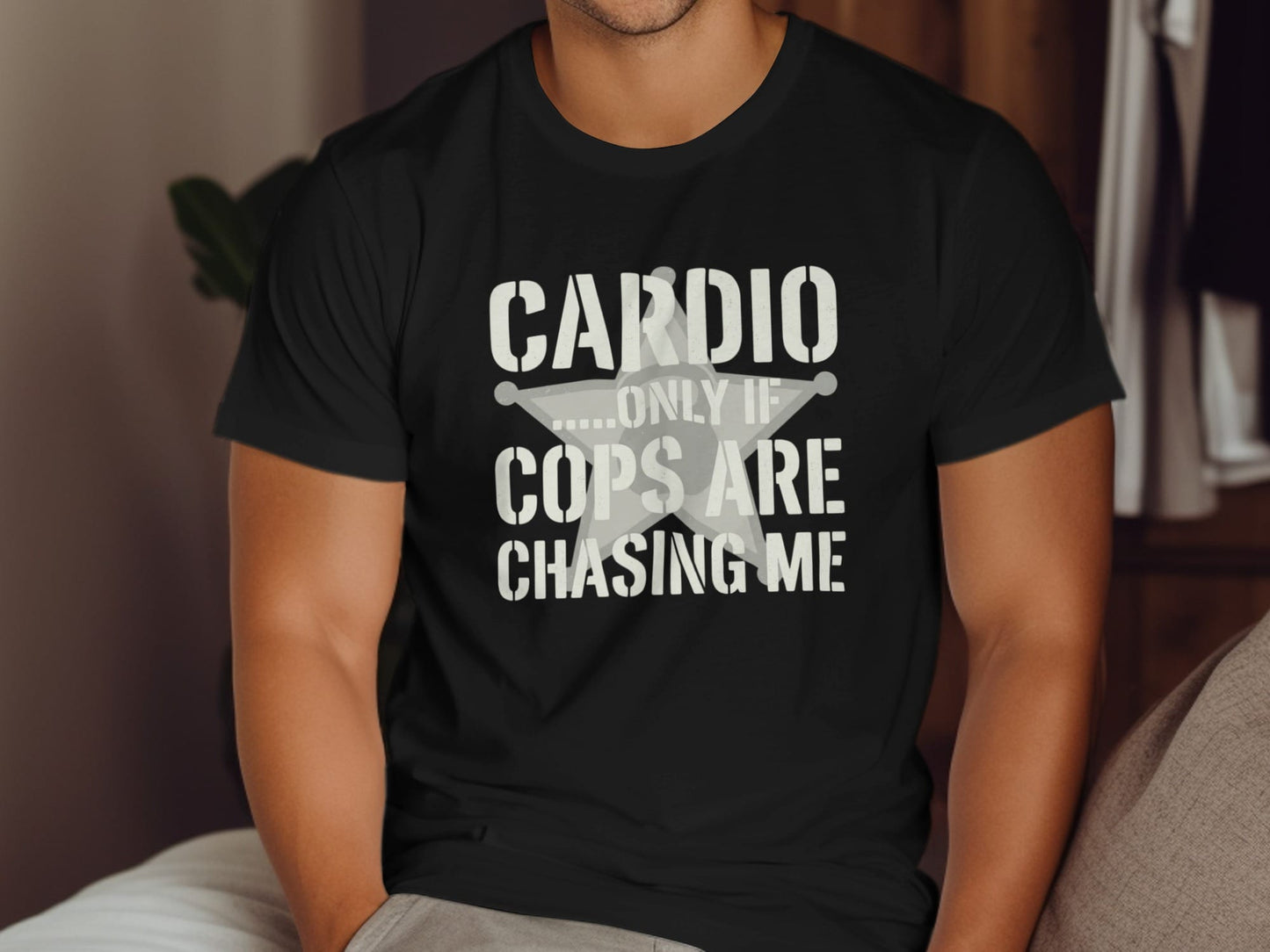 Black t-shirt with text "CARDIO ...ONLY IF COPS ARE CHASING ME" and a star graphic
