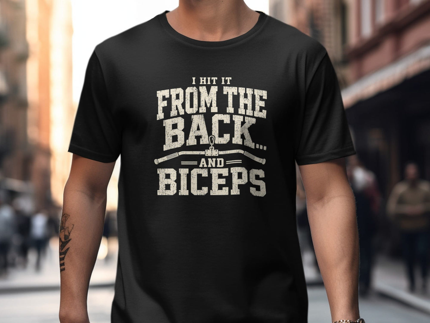 Black t-shirt with distressed text: "I HIT IT FROM THE BACK... AND BICEPS".