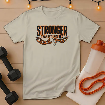 Light beige t-shirt with "Stronger Than My Excuses" chain graphic.