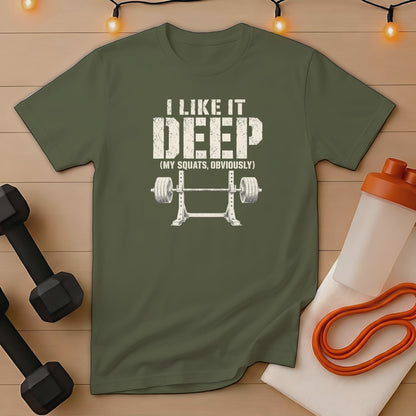 Green t-shirt with "I like it DEEP (MY SQUATS, OBVIOUSLY)" and barbell graphic.