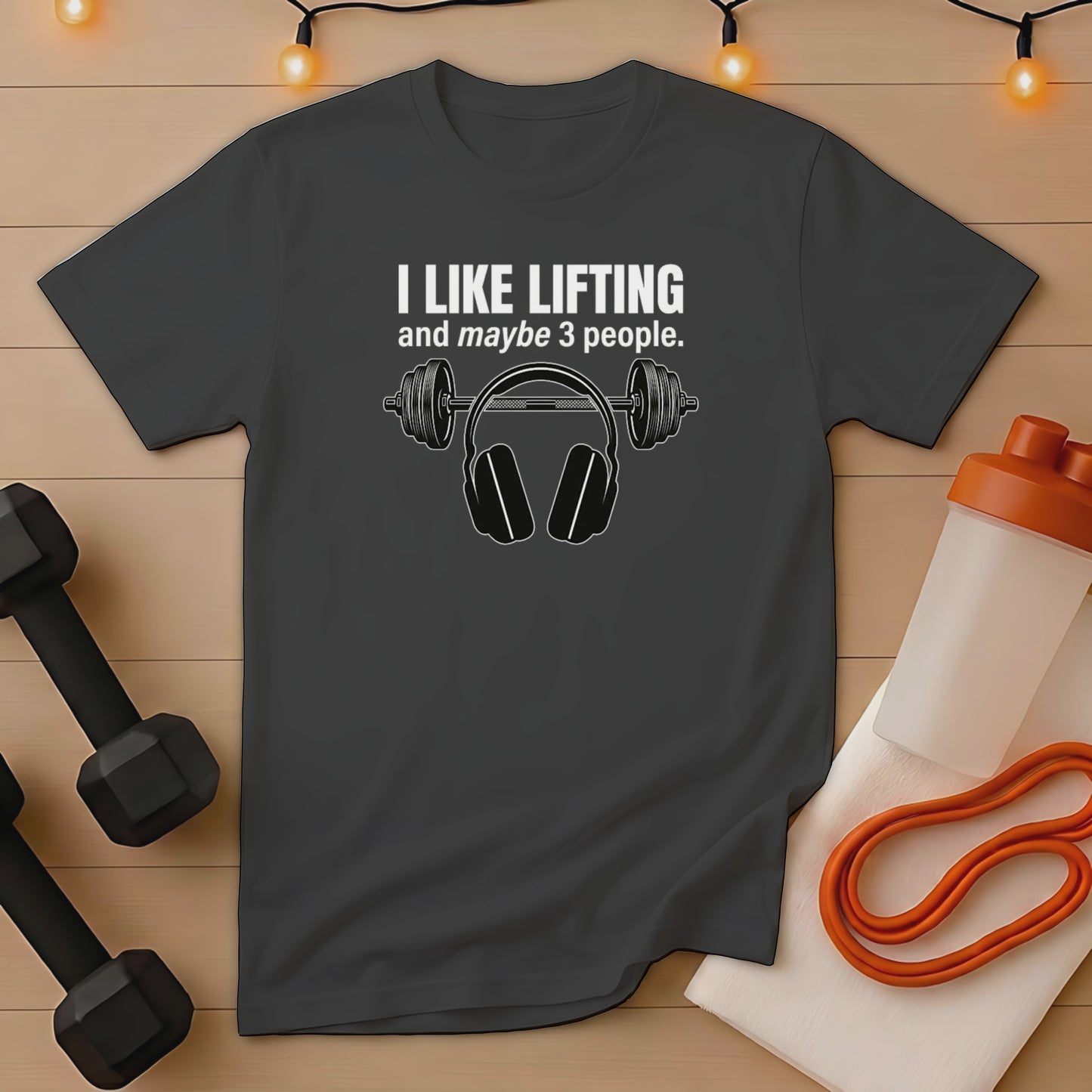 Dark gray t-shirt with "I like lifting and maybe 3 people" and headphones graphic.