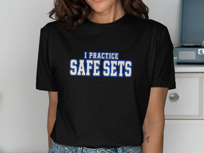 Black t-shirt with text "I PRACTICE SAFE SETS" in blue and white.