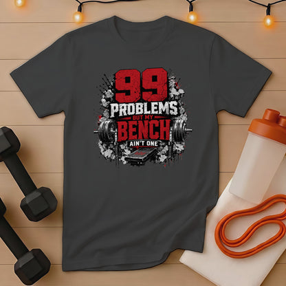 Dark gray t-shirt with "99 Problems But My Bench Ain't One" graphic.