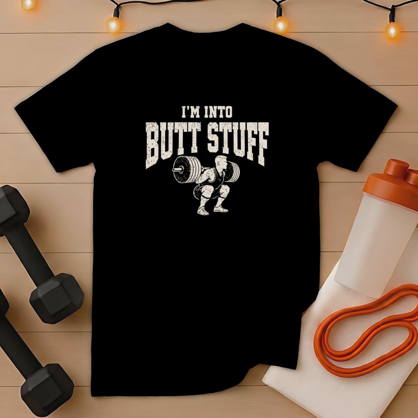 Black t-shirt with "I'M INTO BUTT STUFF" and weightlifter graphic.