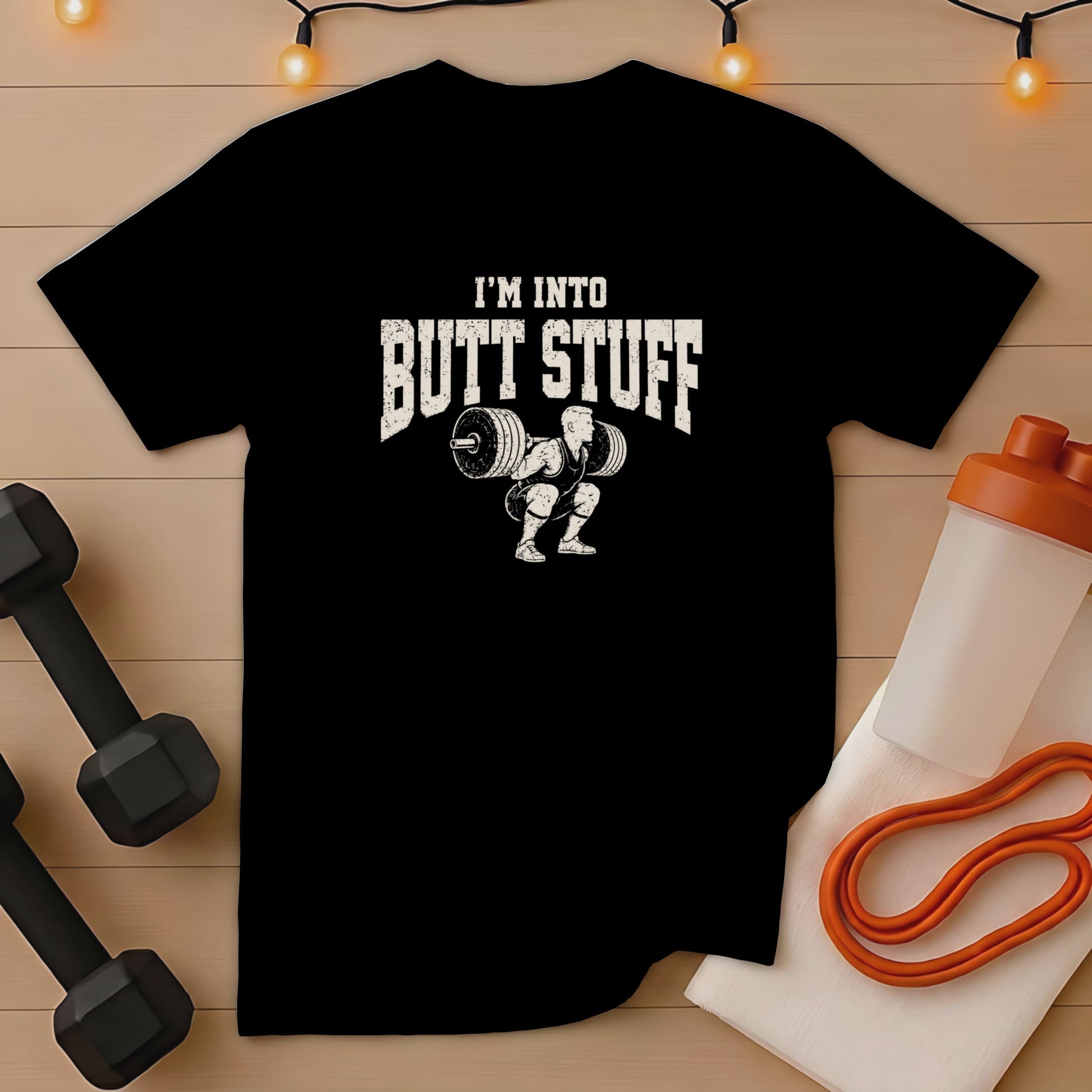 Black t-shirt with "I'M INTO BUTT STUFF" and weightlifter graphic.