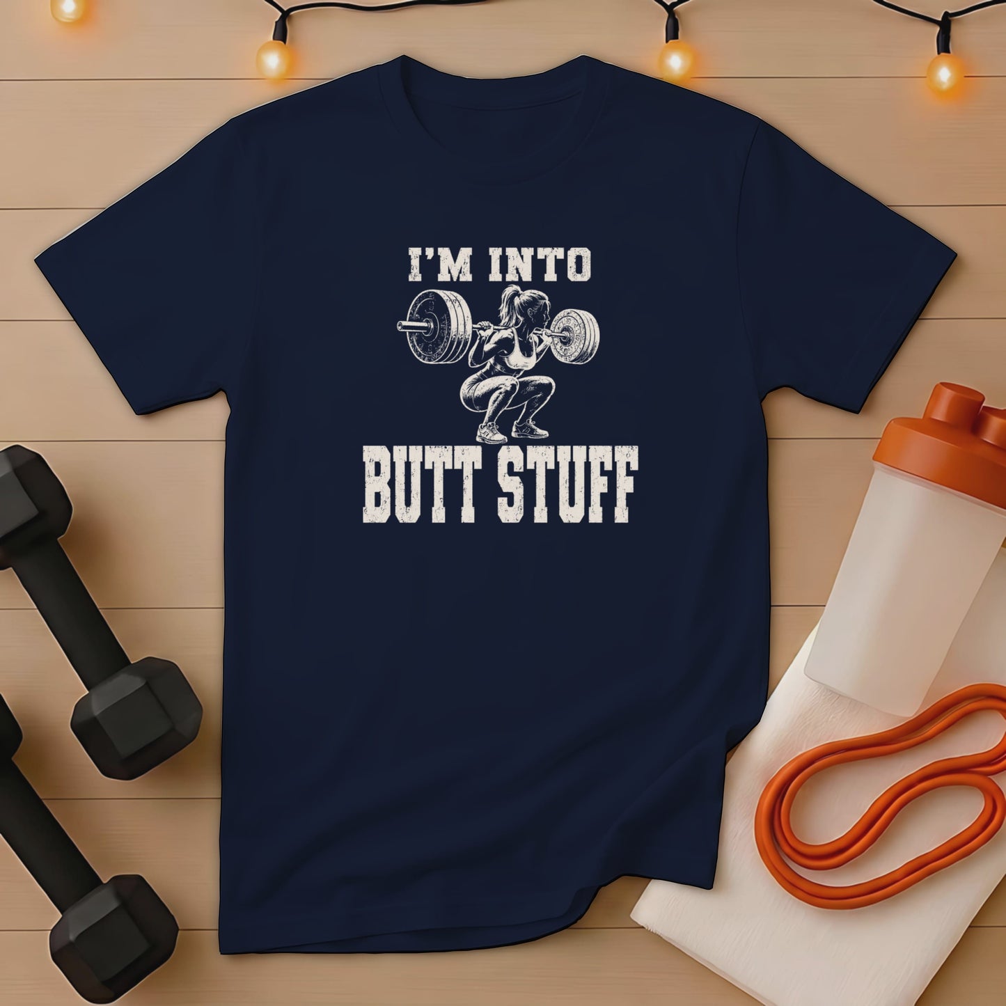 Navy t-shirt with graphic "I'm Into Butt Stuff" and weightlifter illustration.