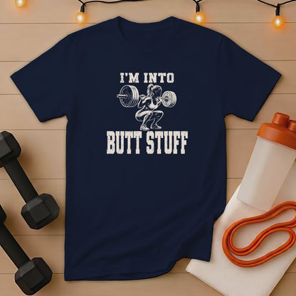 Navy t-shirt with graphic "I'm Into Butt Stuff" and weightlifter illustration.
