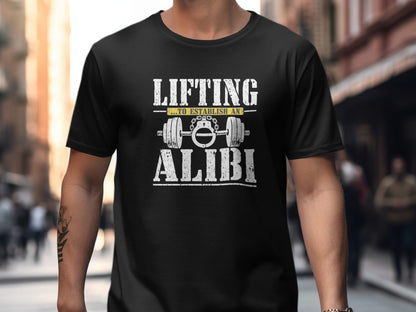 Black t-shirt with graphic text: LIFTING to establish an ALIBI and barbell with handcuffs.