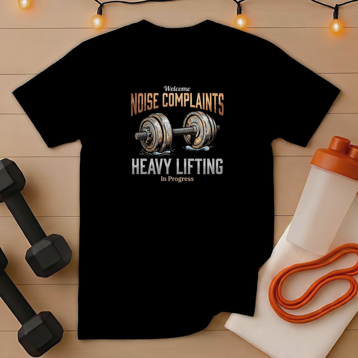 Black t-shirt with "NOISE COMPLAINTS HEAVY LIFTING In Progress" graphic.
