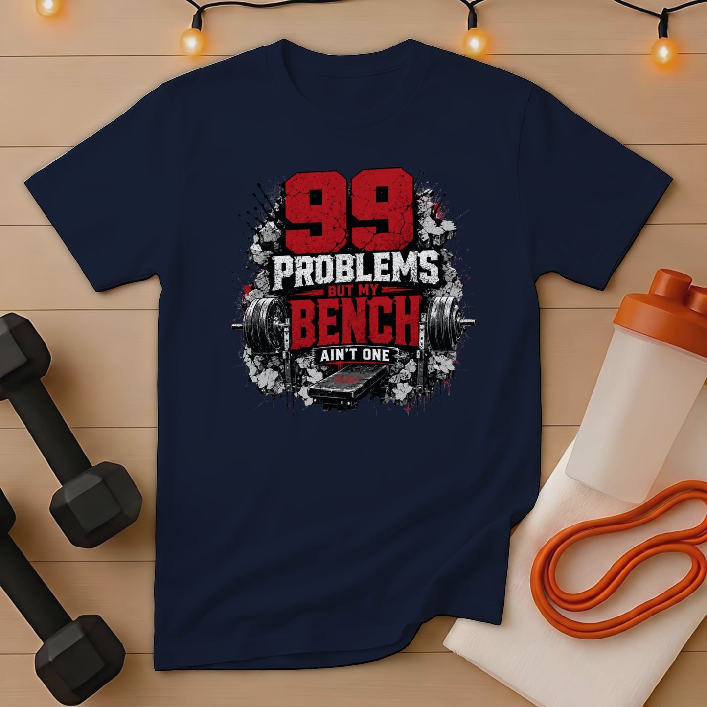 Navy t-shirt with "99 Problems But My Bench Ain't One" graphic.