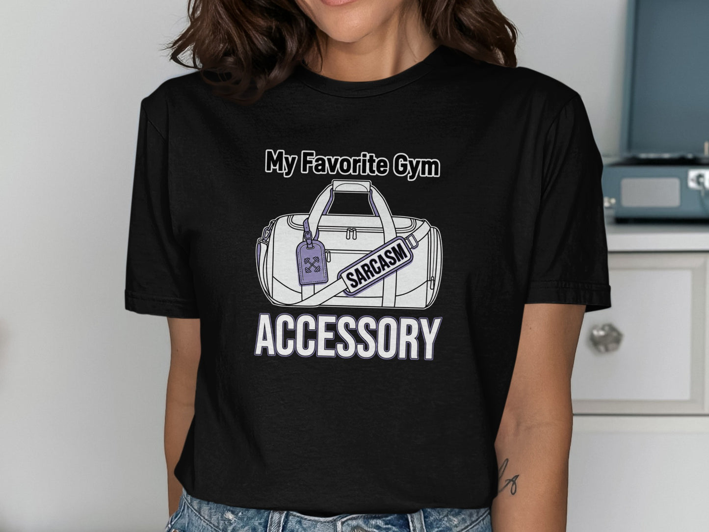 Black t-shirt with a graphic of a gym bag and the text "My Favorite Gym Accessory."
