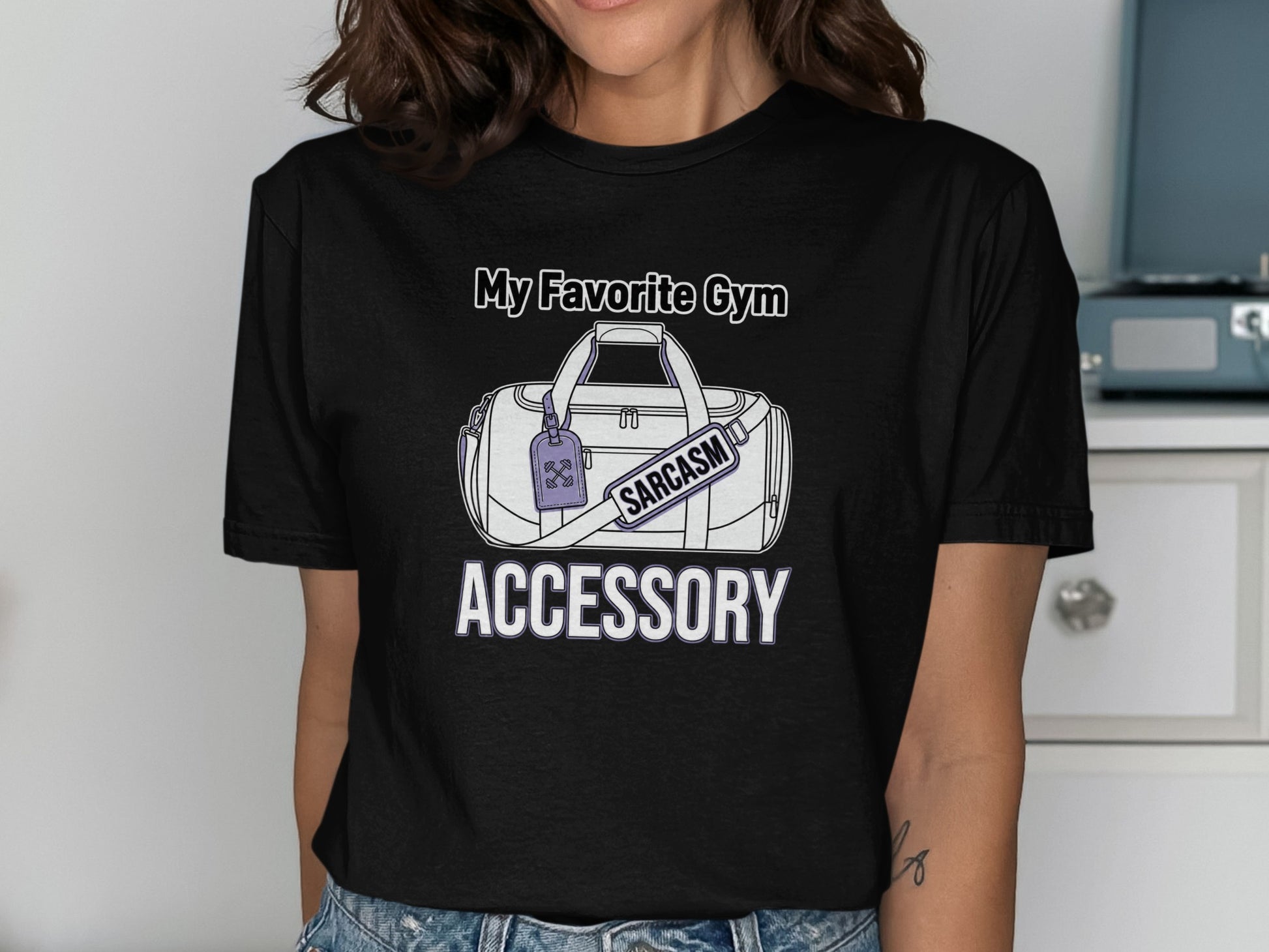 Black t-shirt with a graphic of a gym bag and the text "My Favorite Gym Accessory."