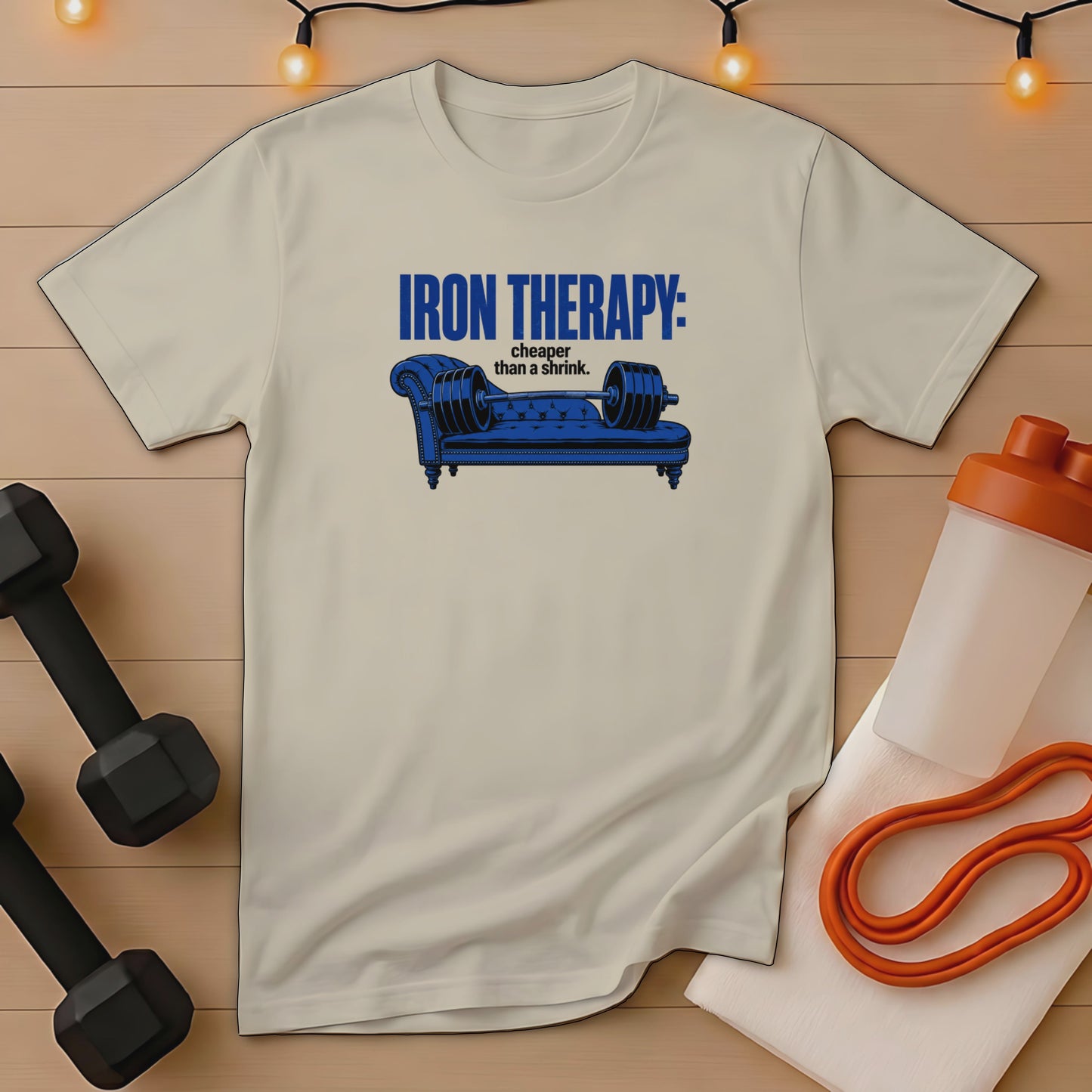 T-shirt with blue text and couch illustration, "Iron Therapy: cheaper than a shrink."