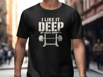 Black t-shirt with text "I LIKE IT DEEP" and squat rack with barbell.