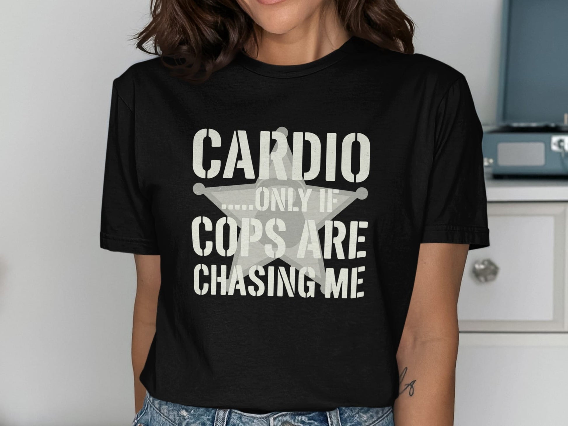 Black t-shirt with text "Cardio.....Only If Cops Are Chasing Me" and a star emblem.