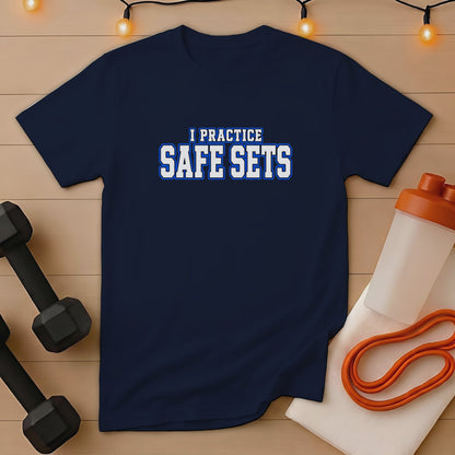Navy t-shirt with "I PRACTICE SAFE SETS" text, dumbbells, and a shaker bottle.