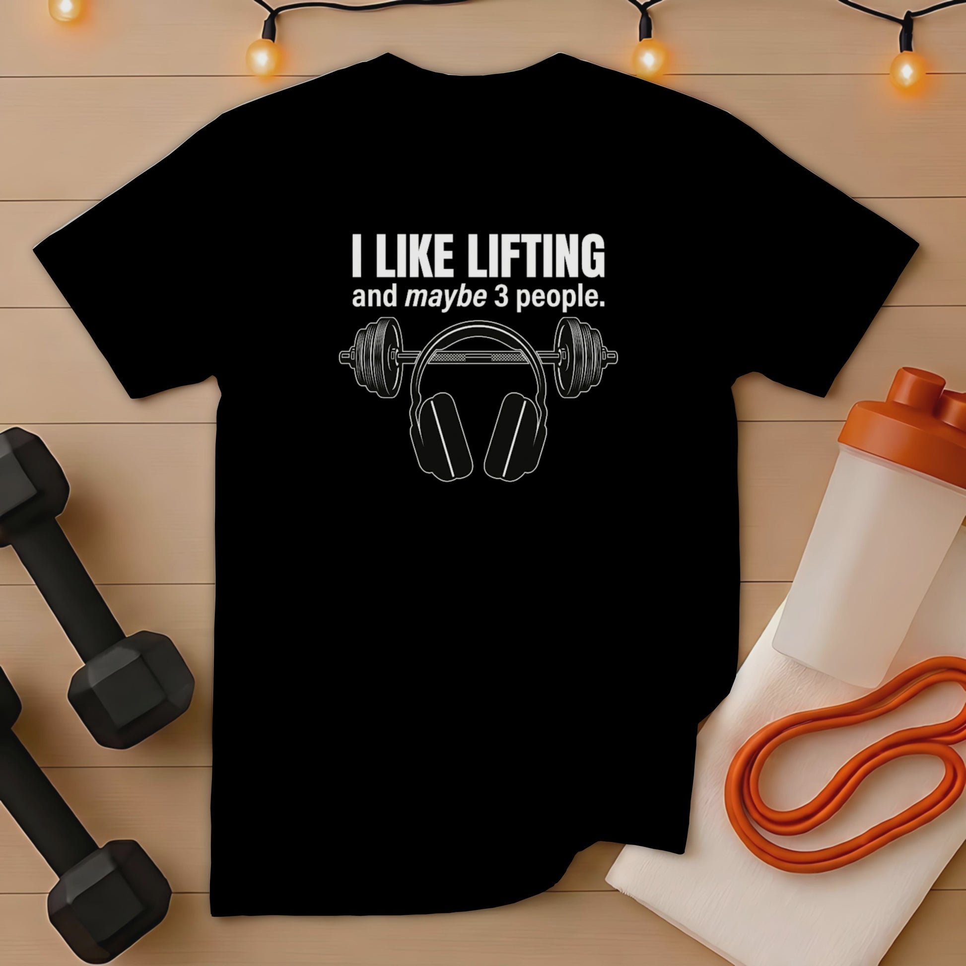 Black t-shirt with headphones graphic and "I like lifting and maybe 3 people" text.