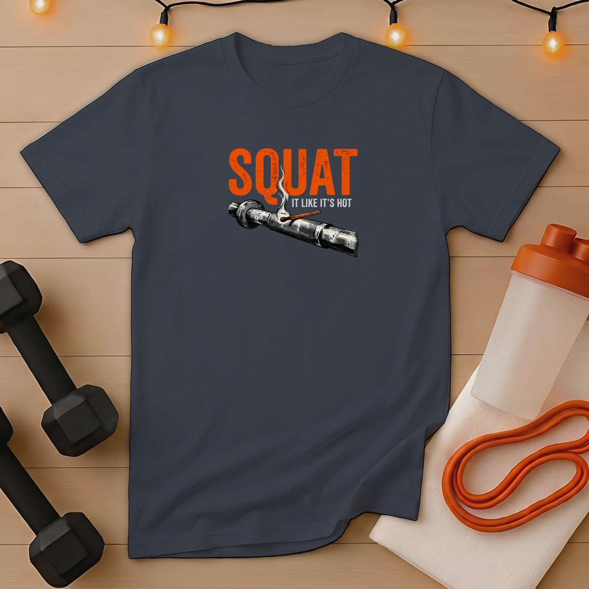 Dark gray t-shirt with "SQUAT IT LIKE IT'S HOT" graphic.