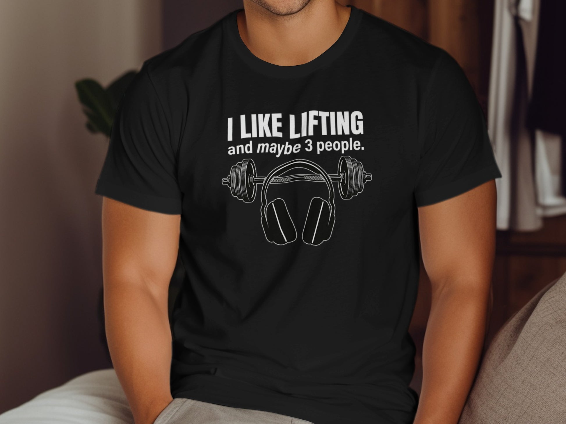 Black t-shirt with "I LIKE LIFTING and maybe 3 people" and barbell headphones design.