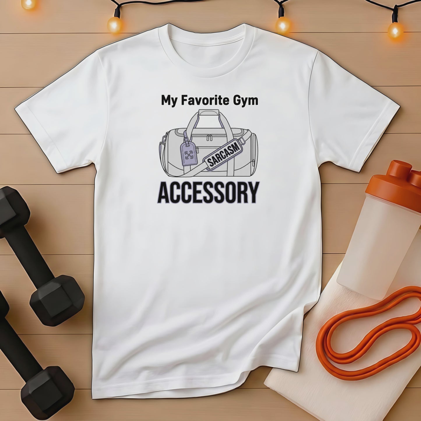 White t-shirt with "My Favorite Gym Accessory" and a luggage tag reading "SARCASTIC".