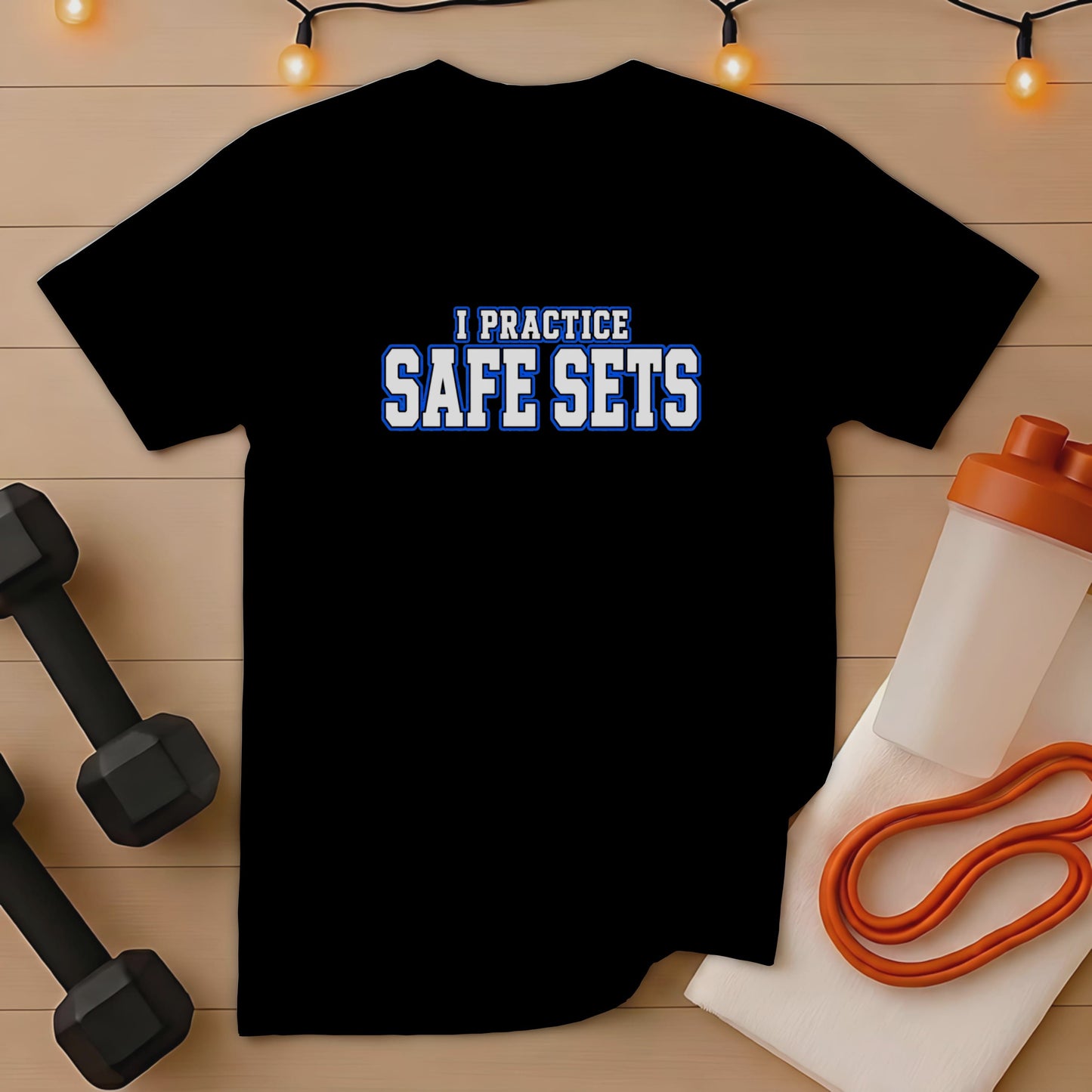 Black t-shirt with "I PRACTICE SAFE SETS" text, dumbbells, and workout accessories.