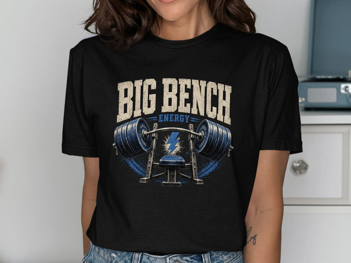 Black t-shirt with "BIG BENCH ENERGY" slogan and barbell graphic.