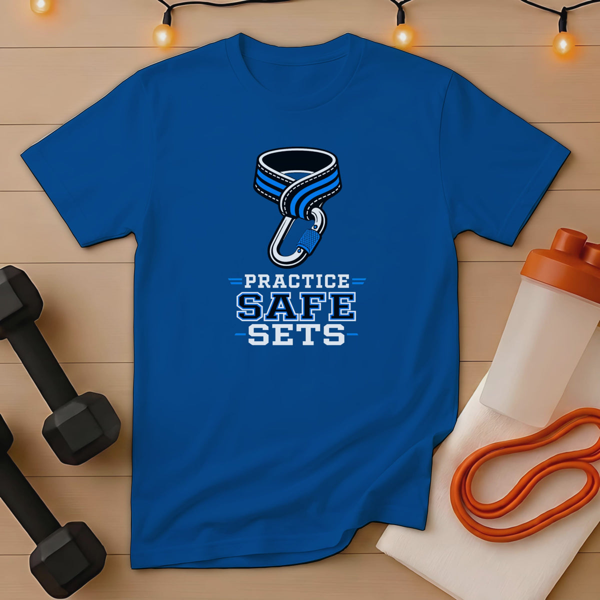 Blue t-shirt with "PRACTICE SAFE SETS" text and carabiner graphic.