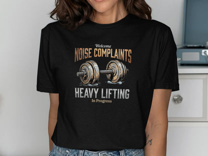 Black t-shirt with "Welcome Noise Complaints Heavy Lifting In Progress" text and barbell.