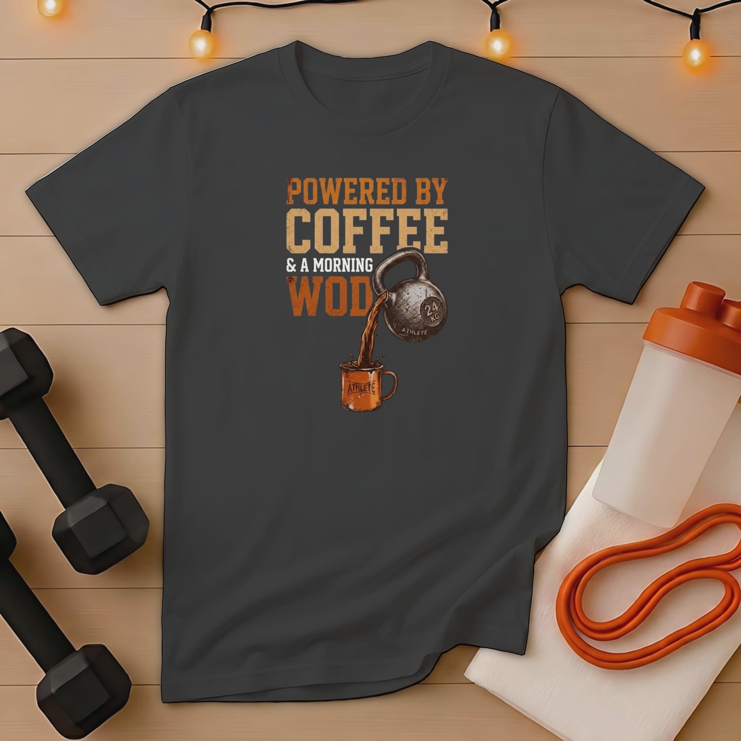 Dark gray t-shirt with "Powered by Coffee & a morning WOD" graphic.