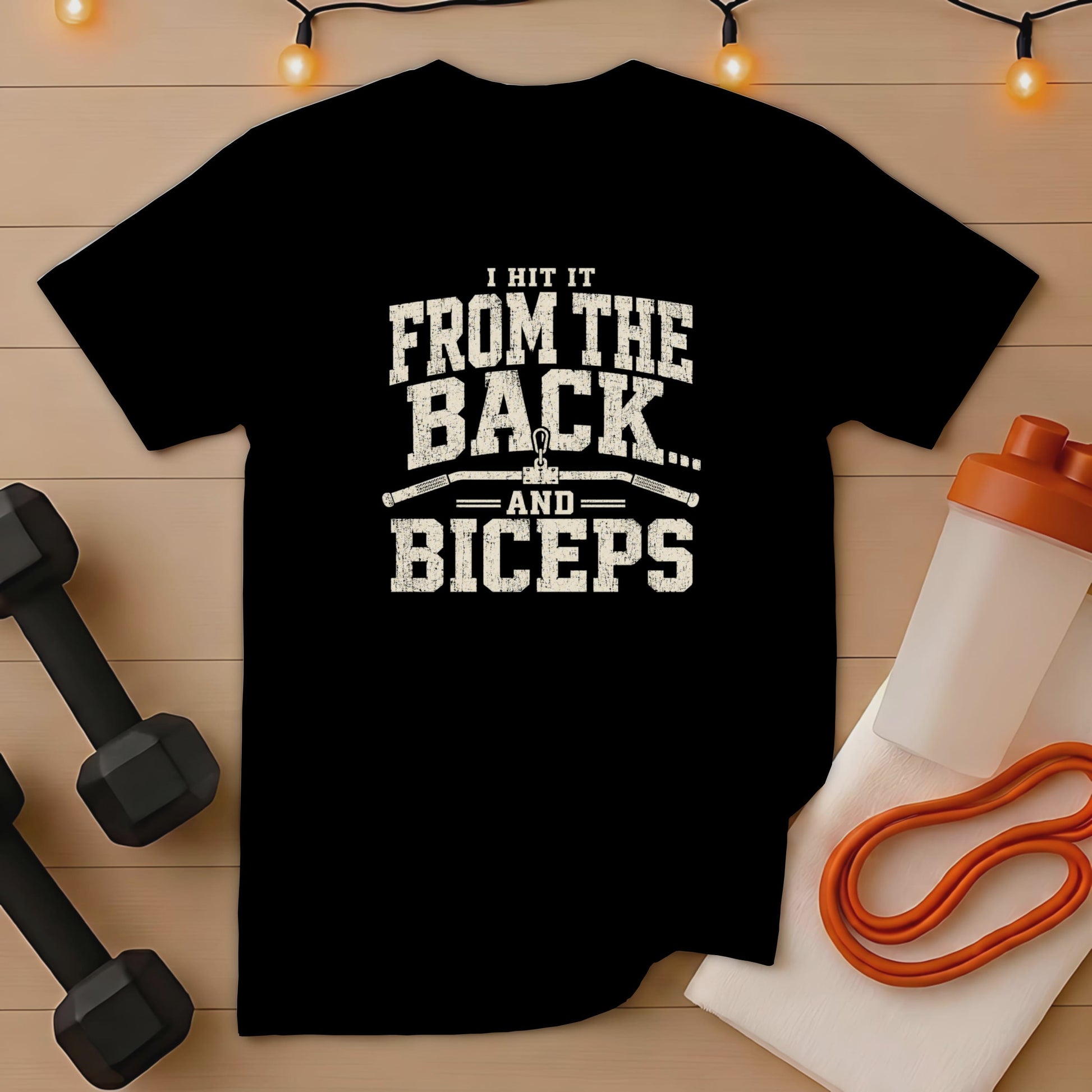 Black t-shirt with distressed text "I HIT IT FROM THE BACK... AND BICEPS".