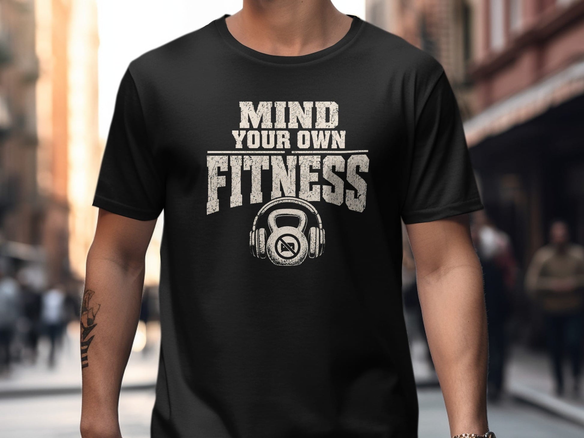 Black t-shirt with "MIND YOUR OWN FITNESS" text and kettlebell icon.