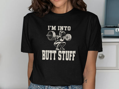 Black t-shirt with text "I'M INTO BUTT STUFF" and graphic of woman lifting barbell.