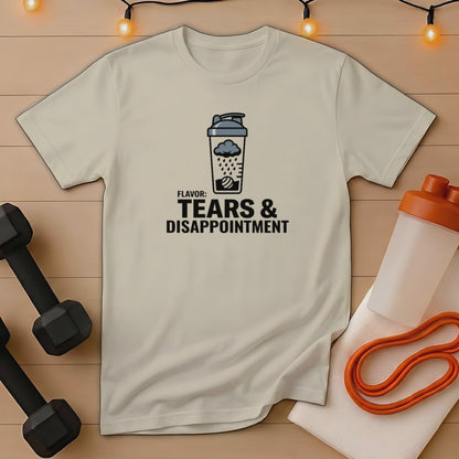 Cream t-shirt with "FLAVOR: TEARS & DISAPPOINTMENT" text and a rain cloud.