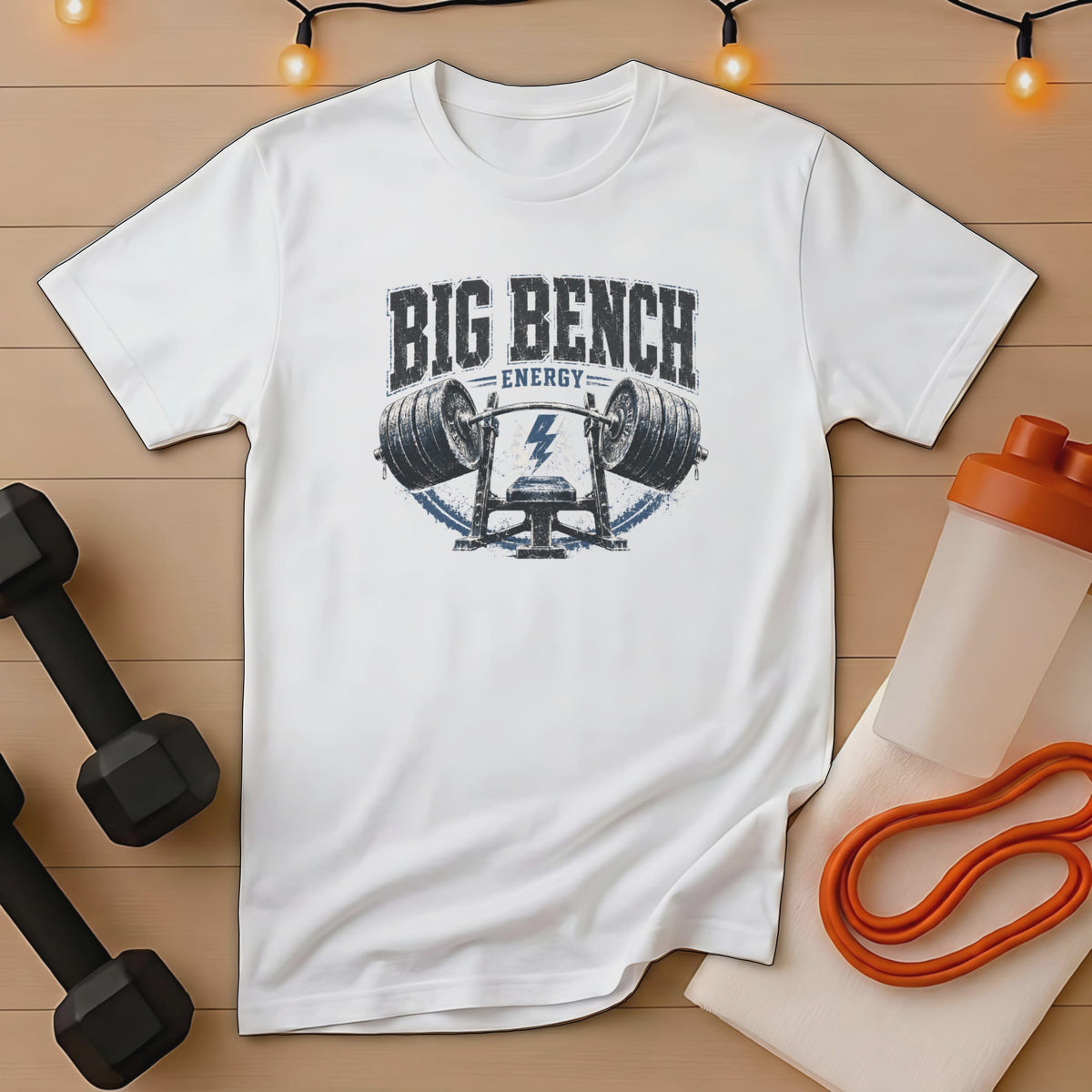 White t-shirt with "BIG BENCH ENERGY" text and barbell graphics.