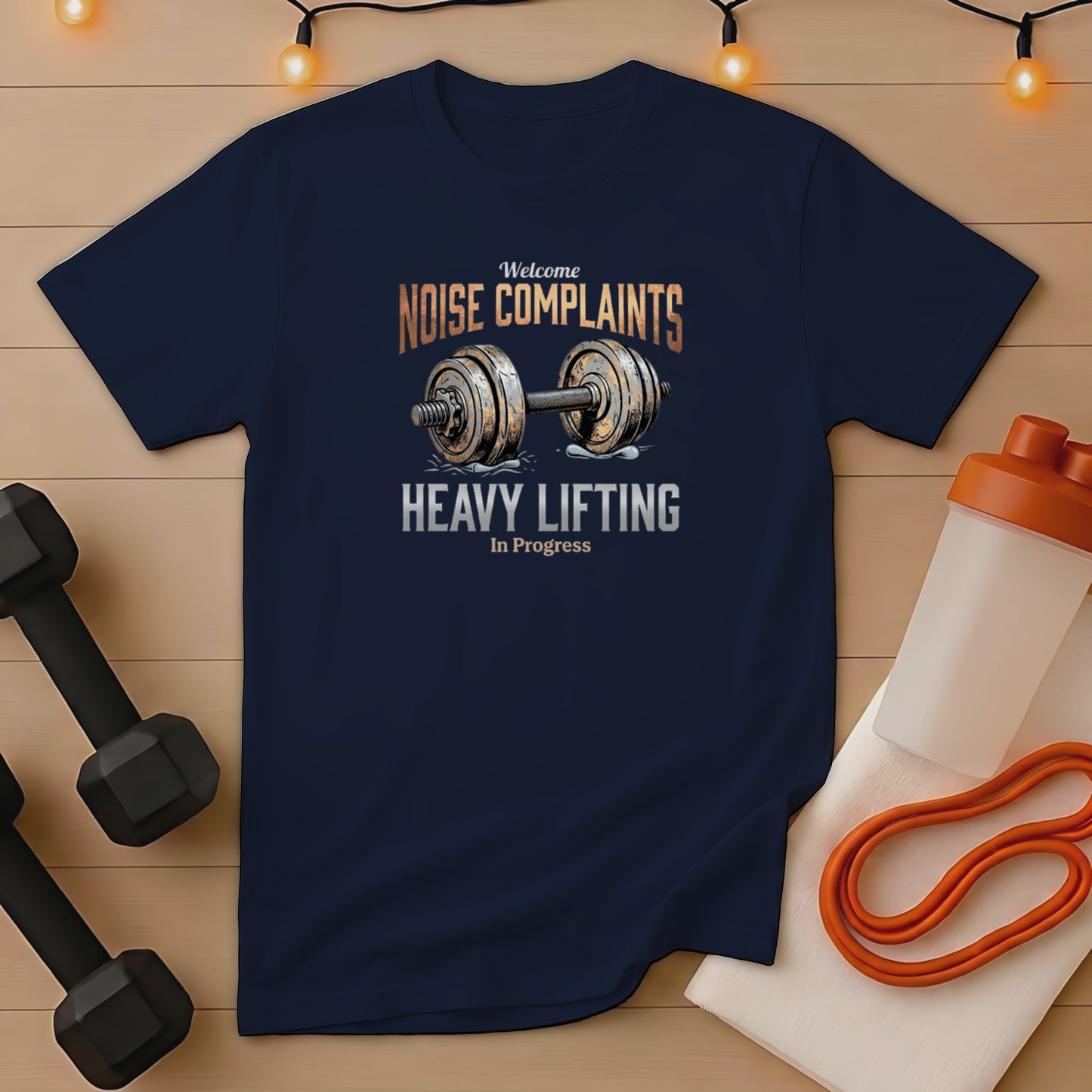 Navy t-shirt with "Welcome Noise Complaints Heavy Lifting In Progress" text and barbell graphic.