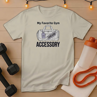 Cream t-shirt with "My Favorite Gym Accessory" and "SARCASTIC" gym bag graphic.