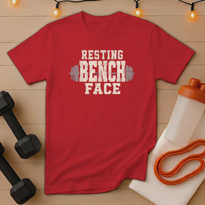 Red t-shirt with "RESTING BENCH FACE" text and dumbbell graphic.