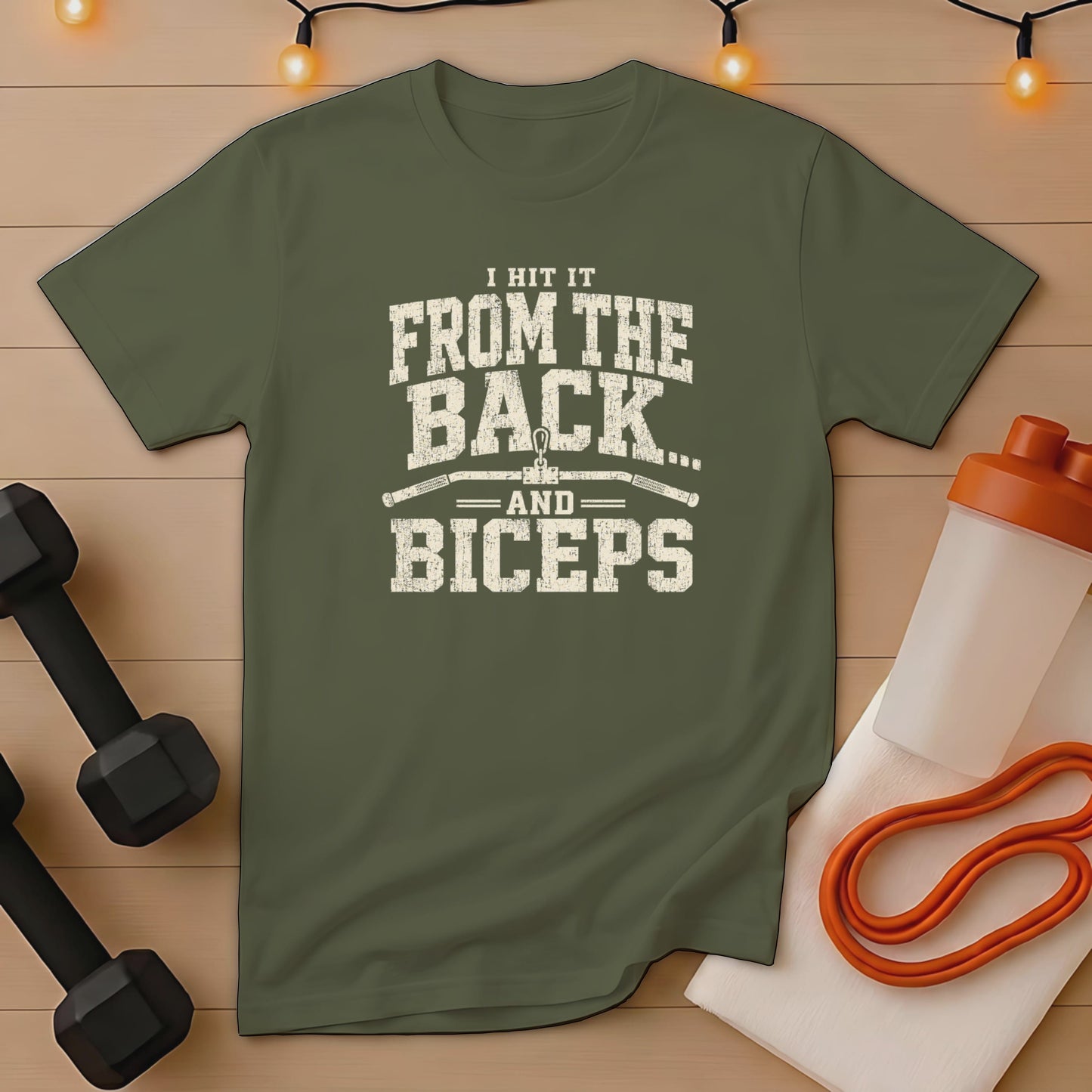 Olive t-shirt with distressed print: "I HIT IT FROM THE BACK... AND BICEPS"