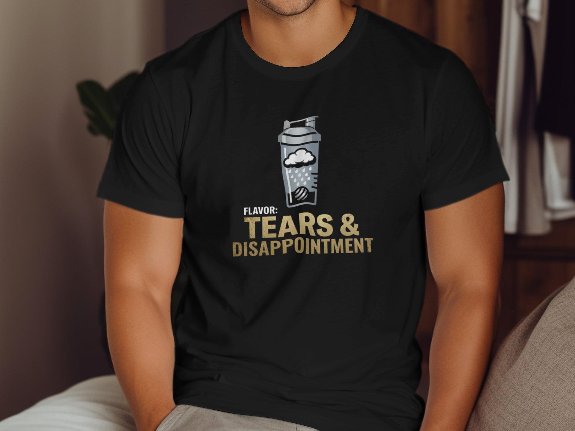 Black t-shirt with "Tears & Disappointment" shaker bottle graphic.