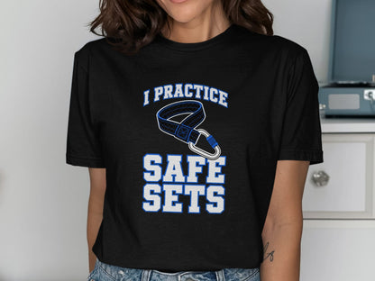 Black t-shirt with text "I PRACTICE SAFE SETS" and climbing carabiner graphic.