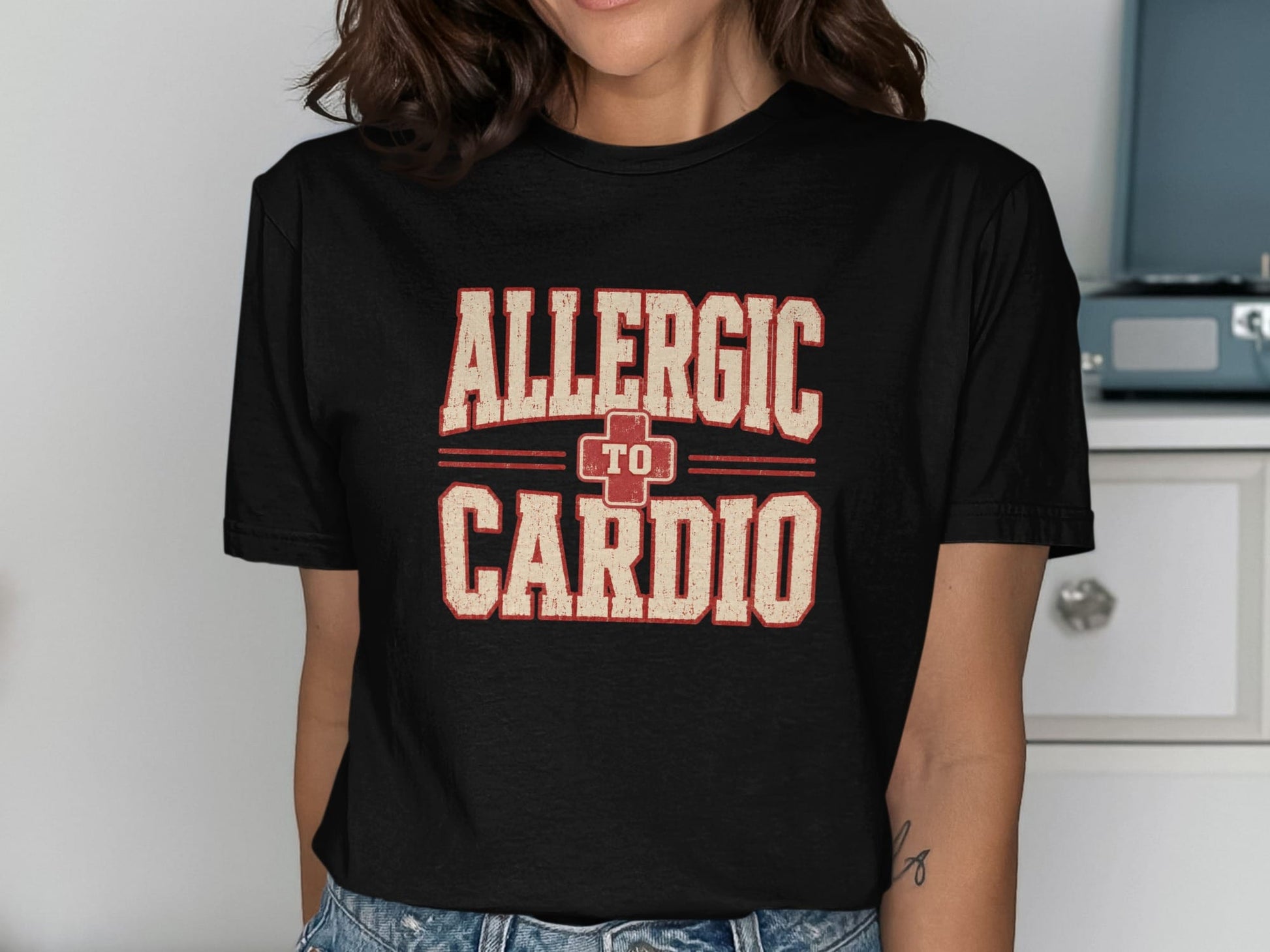 Black t-shirt with \"ALLERGIC TO CARDIO\" text in distressed cream and red lettering.