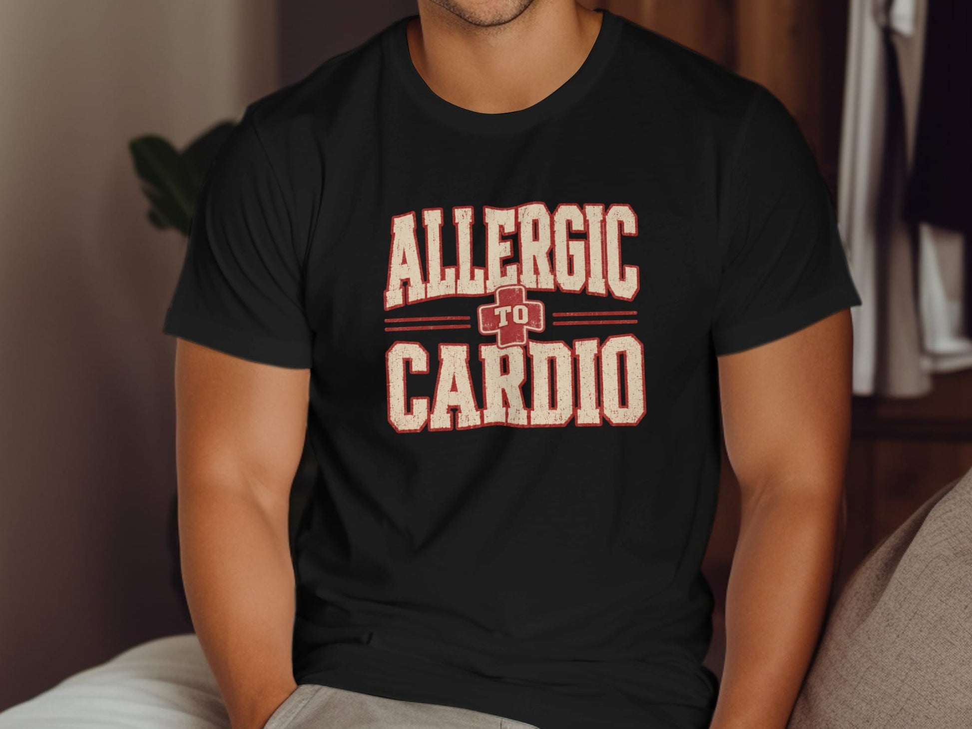Black t-shirt with "Allergic to Cardio" text and a red plus symbol.