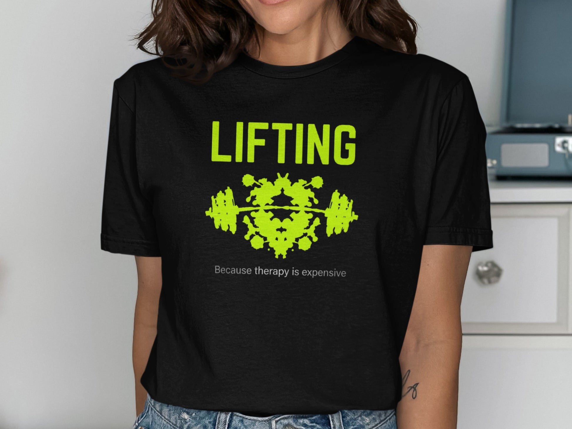 Black t-shirt with lime green text "LIFTING" and Rorschach inkblot.
