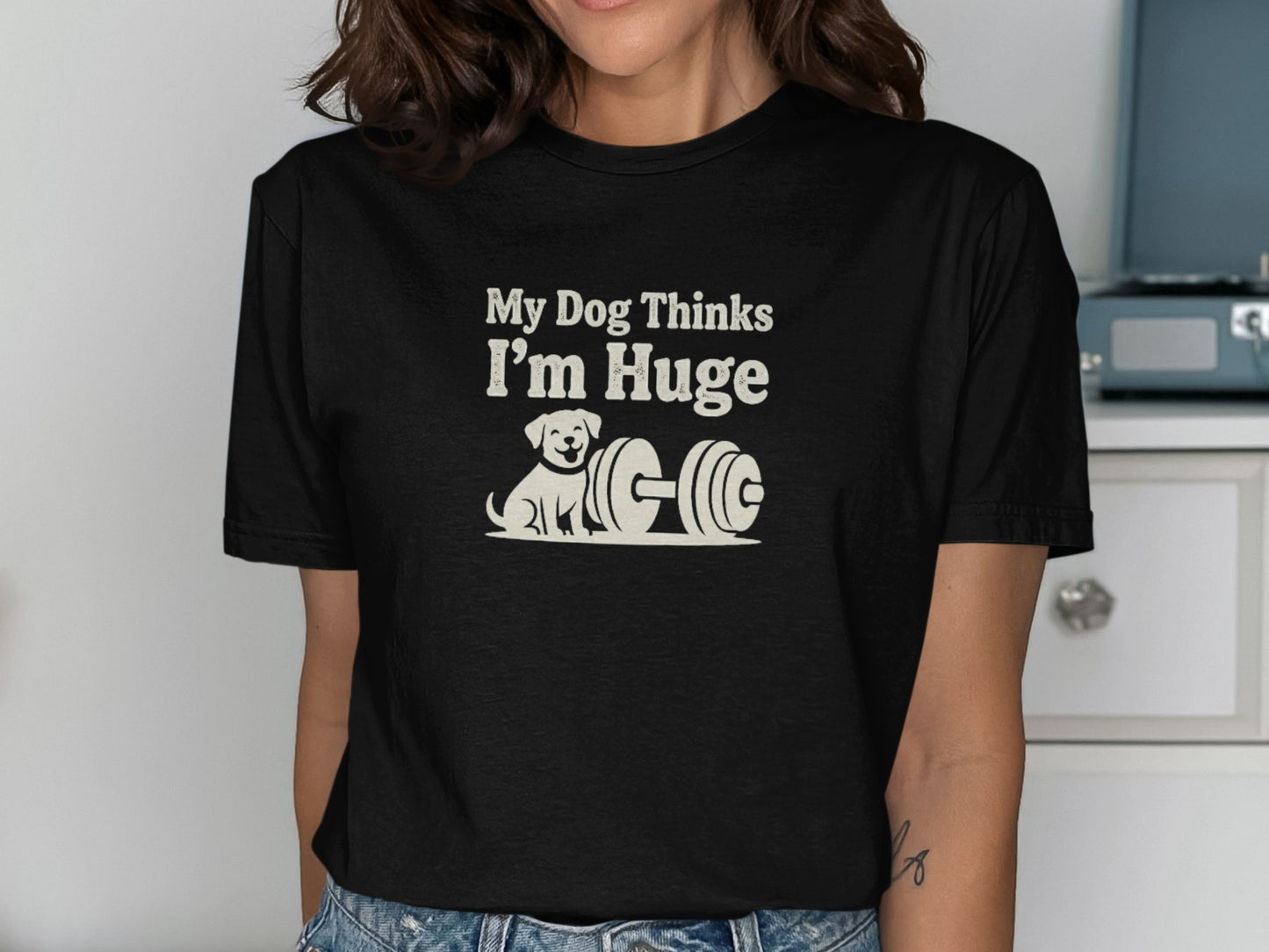 Black t-shirt with "My Dog Thinks I'm Huge" and a cartoon dog next to a dumbbell.