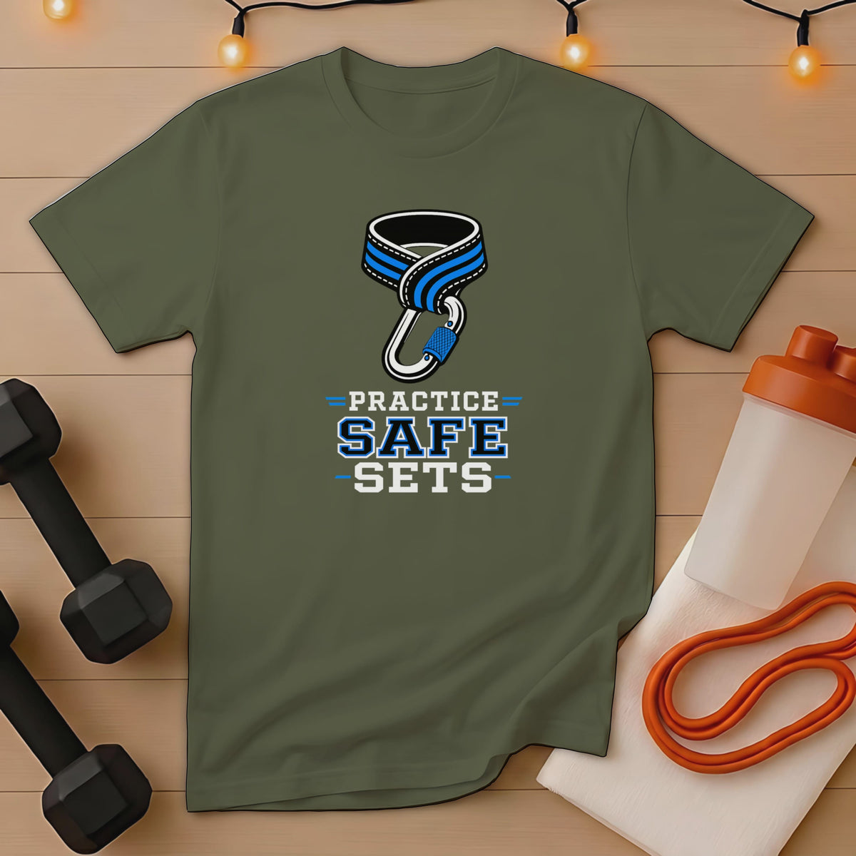 Green t-shirt with "PRACTICE SAFE SETS" text, featuring a carabiner and rope graphic.