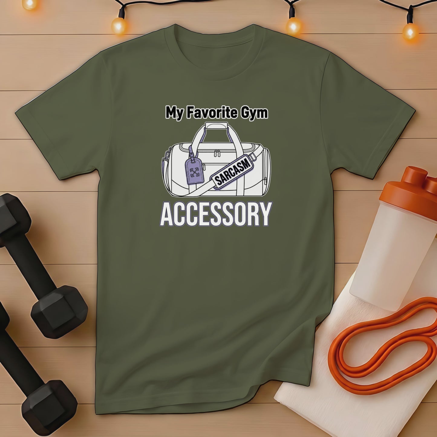 Olive green t-shirt with "My Favorite Gym Accessory" and "SARCASM" text and graphic.