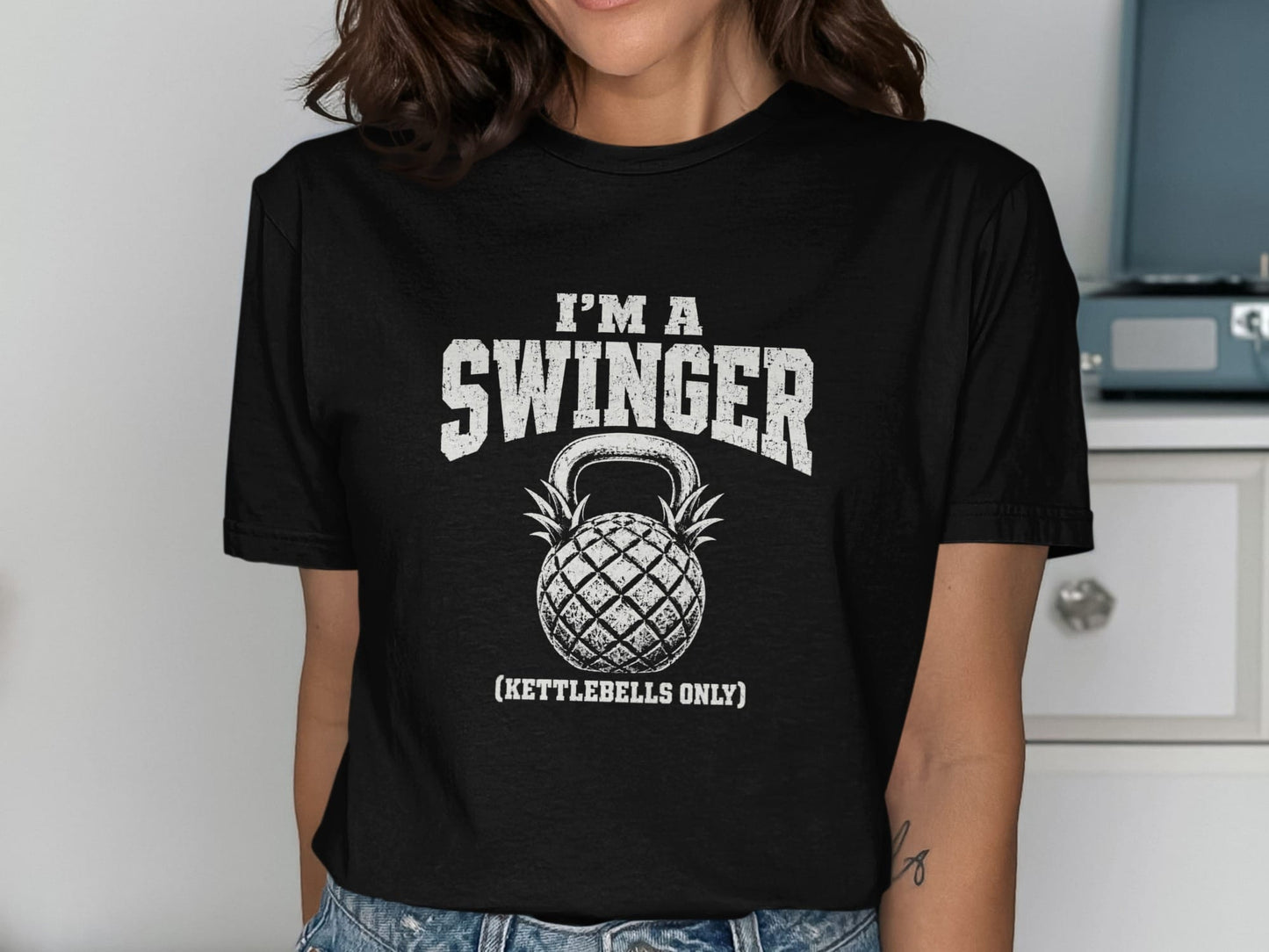 Black t-shirt with distressed white text "I'M A SWINGER (KETTLEBELLS ONLY)" and a kettlebell.