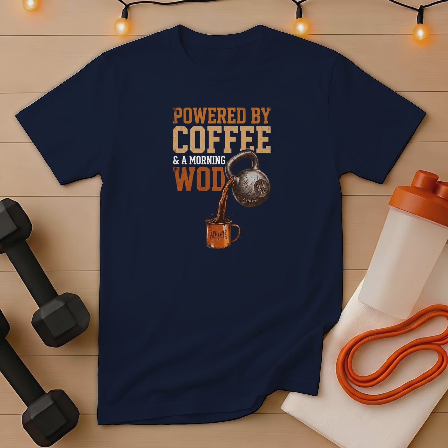 Navy t-shirt with "Powered by Coffee & a Morning WOD" text and kettlebell graphic.