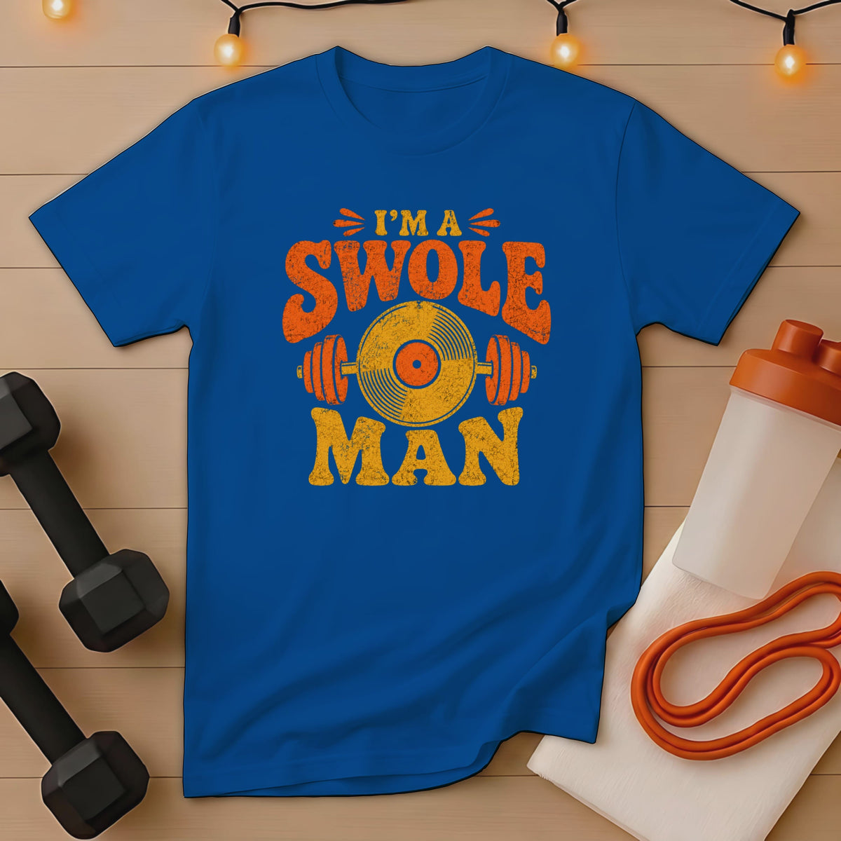 Blue t-shirt with distressed text "I'M A SWOLE MAN" and barbell graphic.